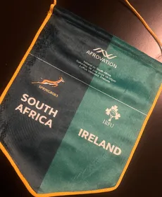 Folded branded scarves in South African and Irish colours.